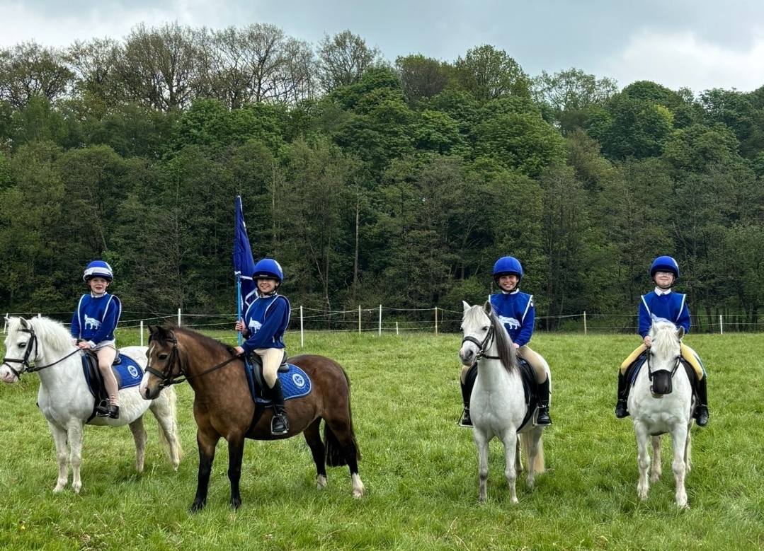 Young Fylde and District Pony Club members out riding together